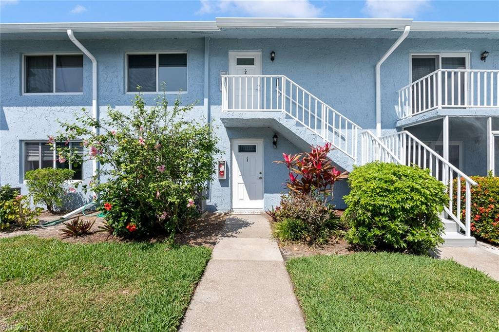 240 Palm Drive, Unit 481 Naples, FL 34112 - Photo 17 of 17 a front view of a house with garden