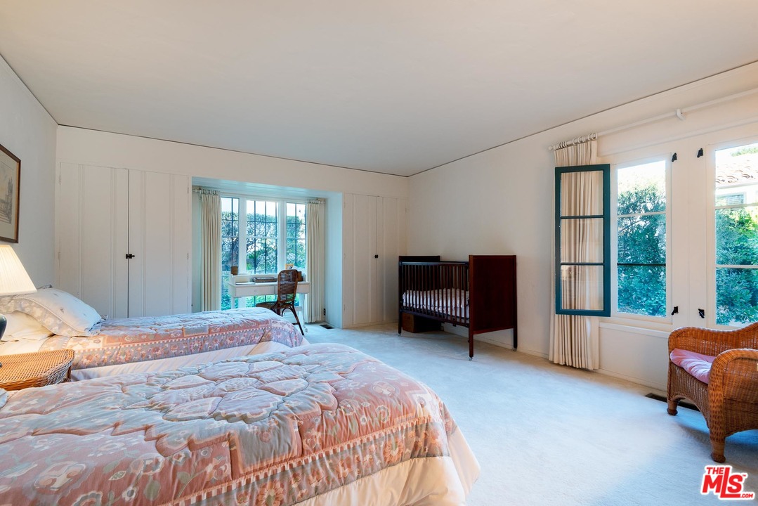 1806 El Encanto Road Santa Barbara, CA 93103 - Photo 8 of 20 a bedroom with a bed and large windows