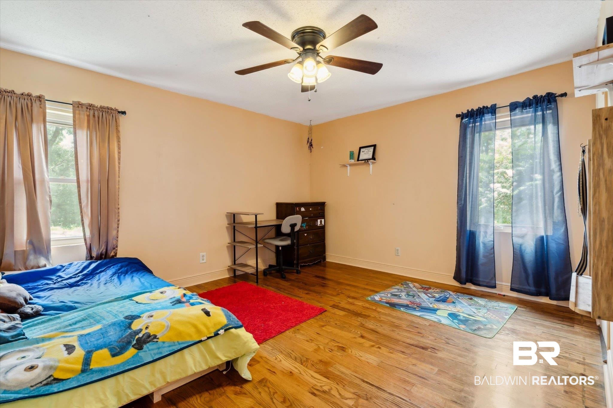4851 Lesure Road Theodore, AL 36582 - Photo 14 of 21 Bedroom featuring multiple windows, light wood-type flooring, and ceiling fan