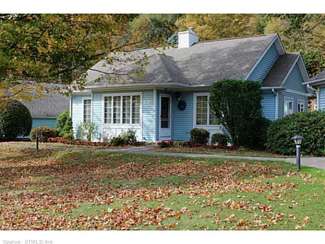 5 Bittersweet Ridge, Unit 5 Middlefield, CT 06455 - Photo 1 of 1 a front view of a house with garden