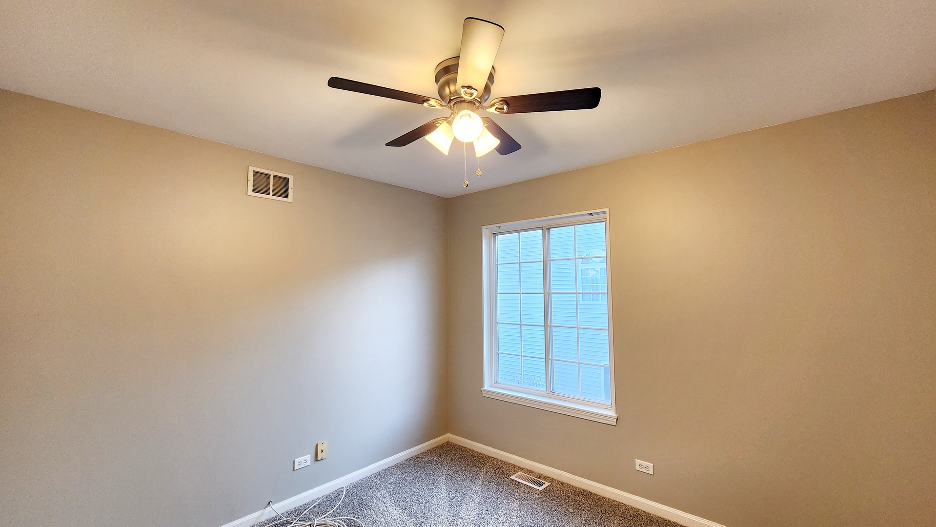 1296 Spaulding Road Bartlett, IL 60103 - Photo 20 of 37 an empty room with windows and fan