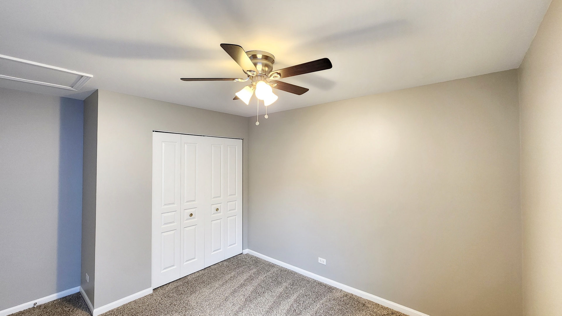 1296 Spaulding Road Bartlett, IL 60103 - Photo 24 of 37 an empty room with a ceiling fan and a window