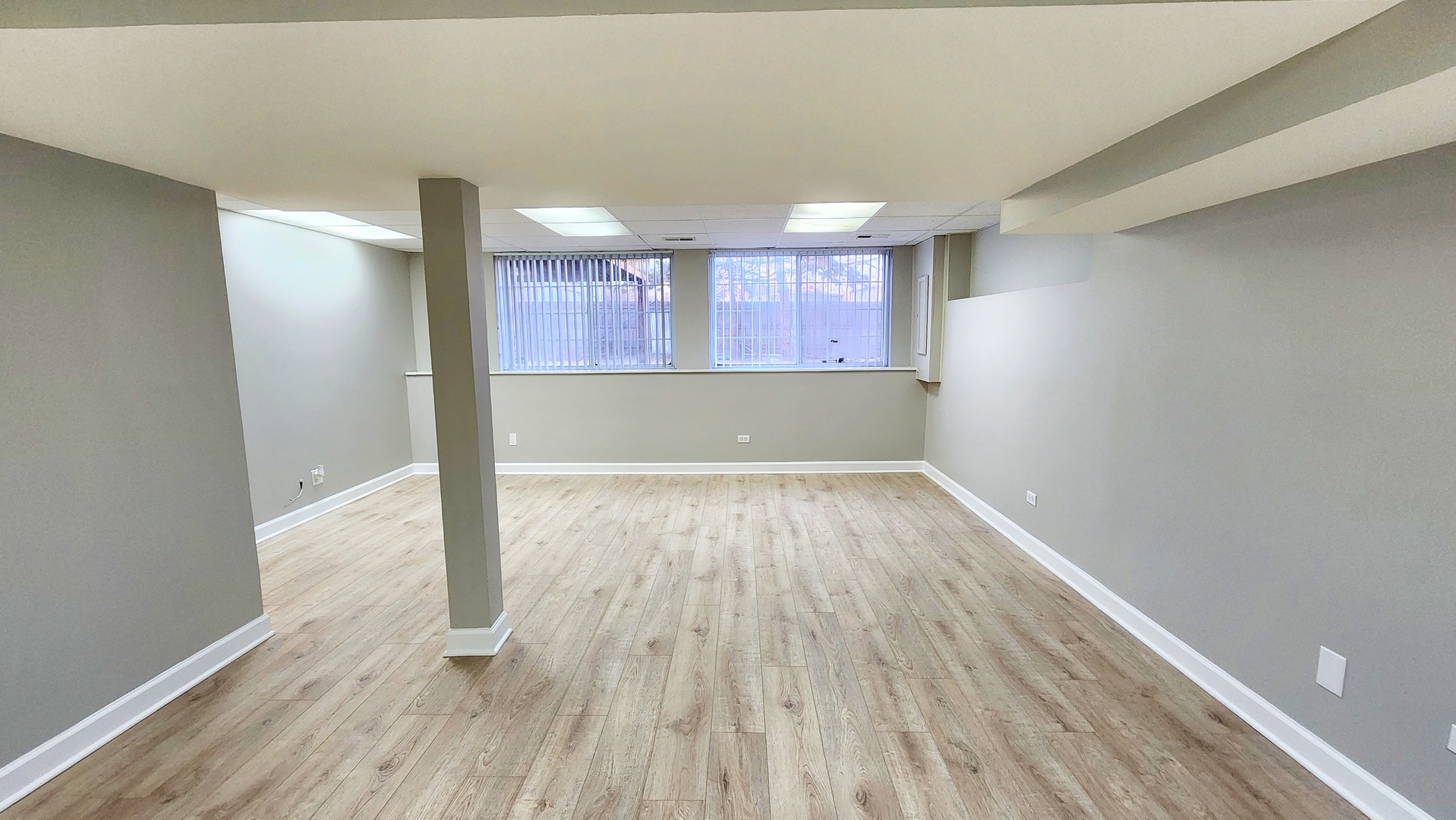 1296 Spaulding Road Bartlett, IL 60103 - Photo 26 of 37 a view of a room with wooden floor and brick walls