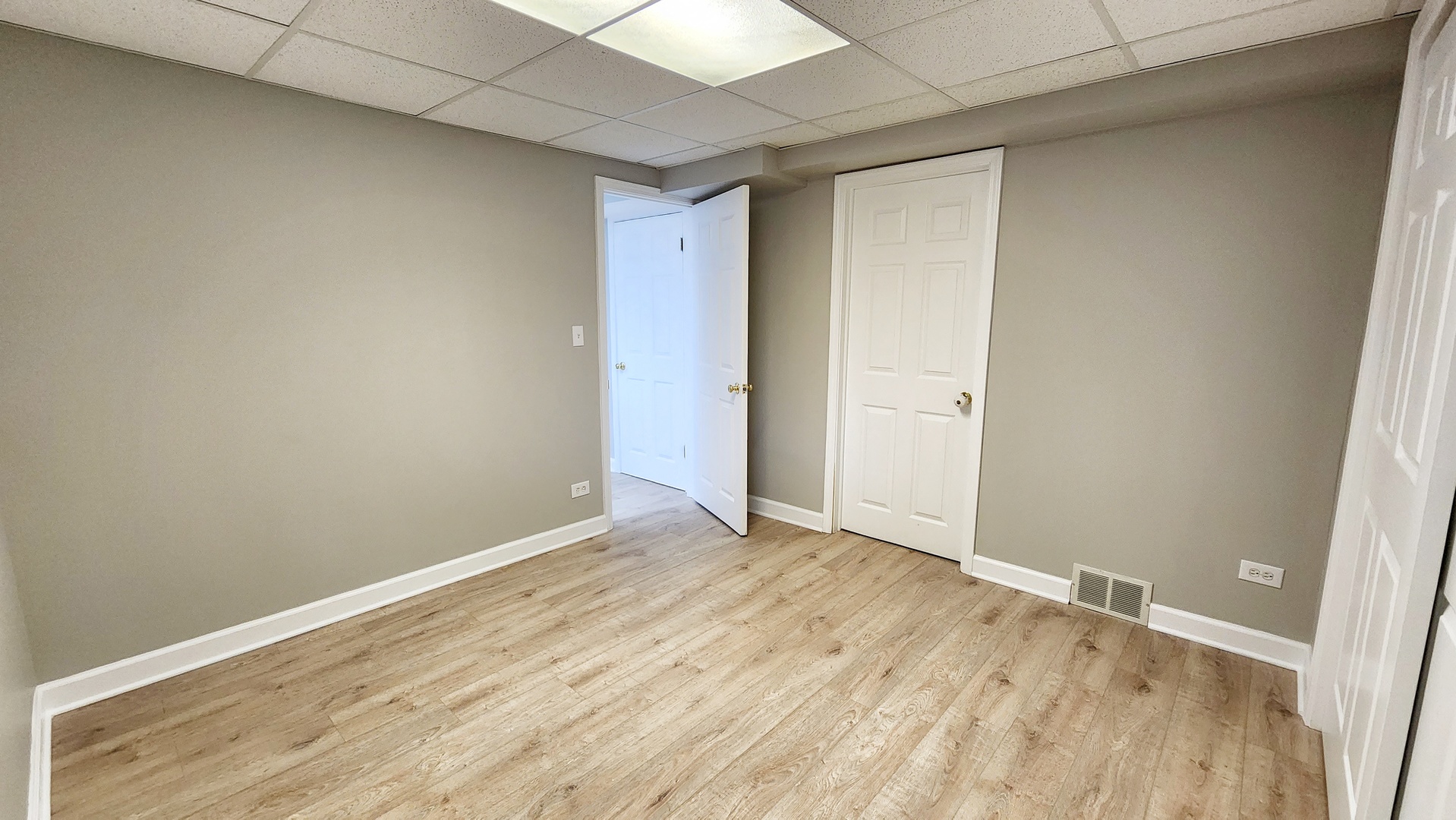 1296 Spaulding Road Bartlett, IL 60103 - Photo 30 of 37 a view of an empty room with wooden floor