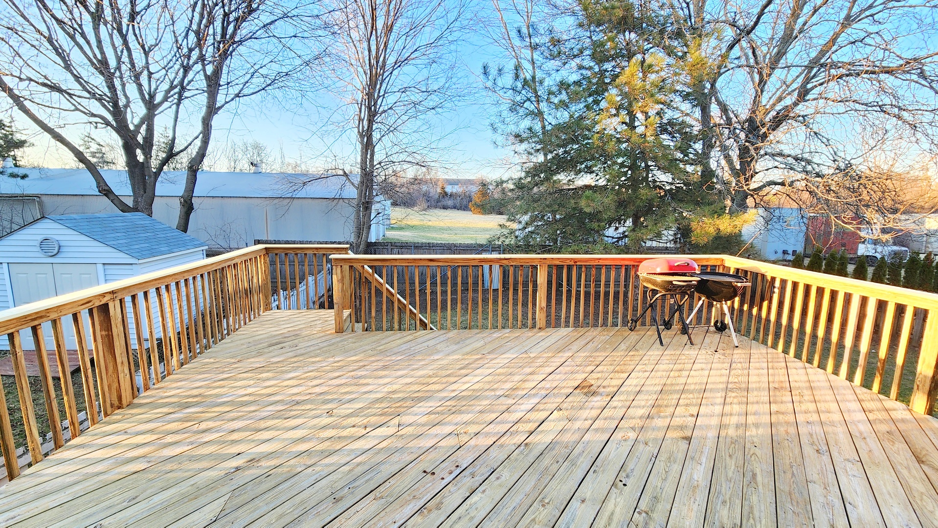 1296 Spaulding Road Bartlett, IL 60103 - Photo 31 of 37 a balcony with wooden floor and fence