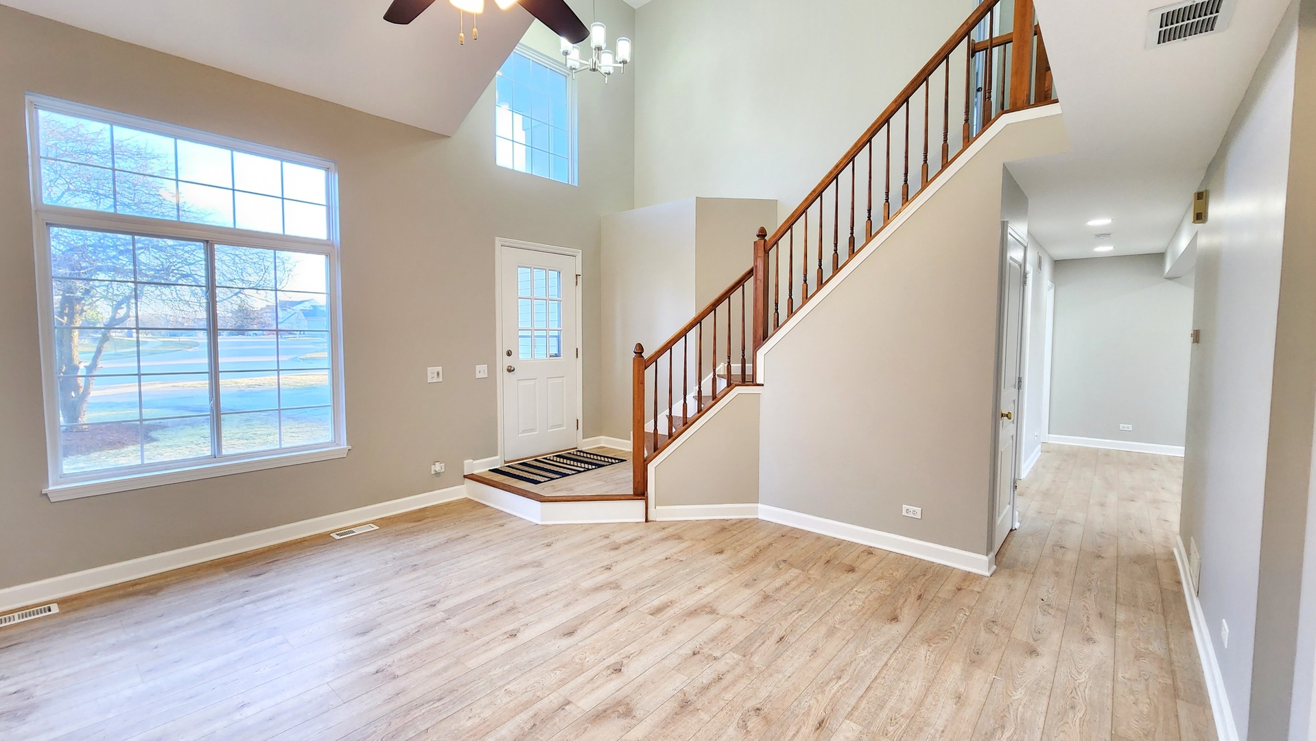 1296 Spaulding Road Bartlett, IL 60103 - Photo 4 of 37 a view of an entryway with wooden floor and stairs