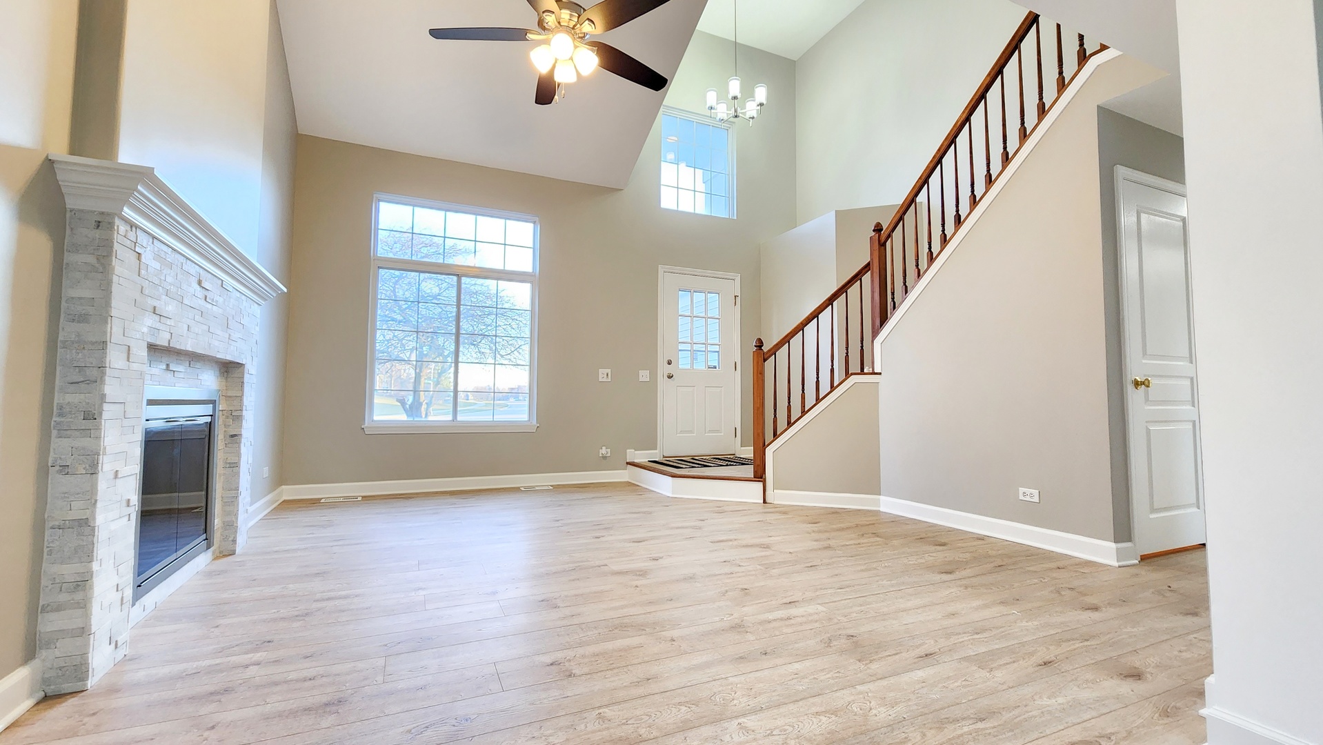 1296 Spaulding Road Bartlett, IL 60103 - Photo 6 of 37 a view of an entryway with wooden floor and livingroom view