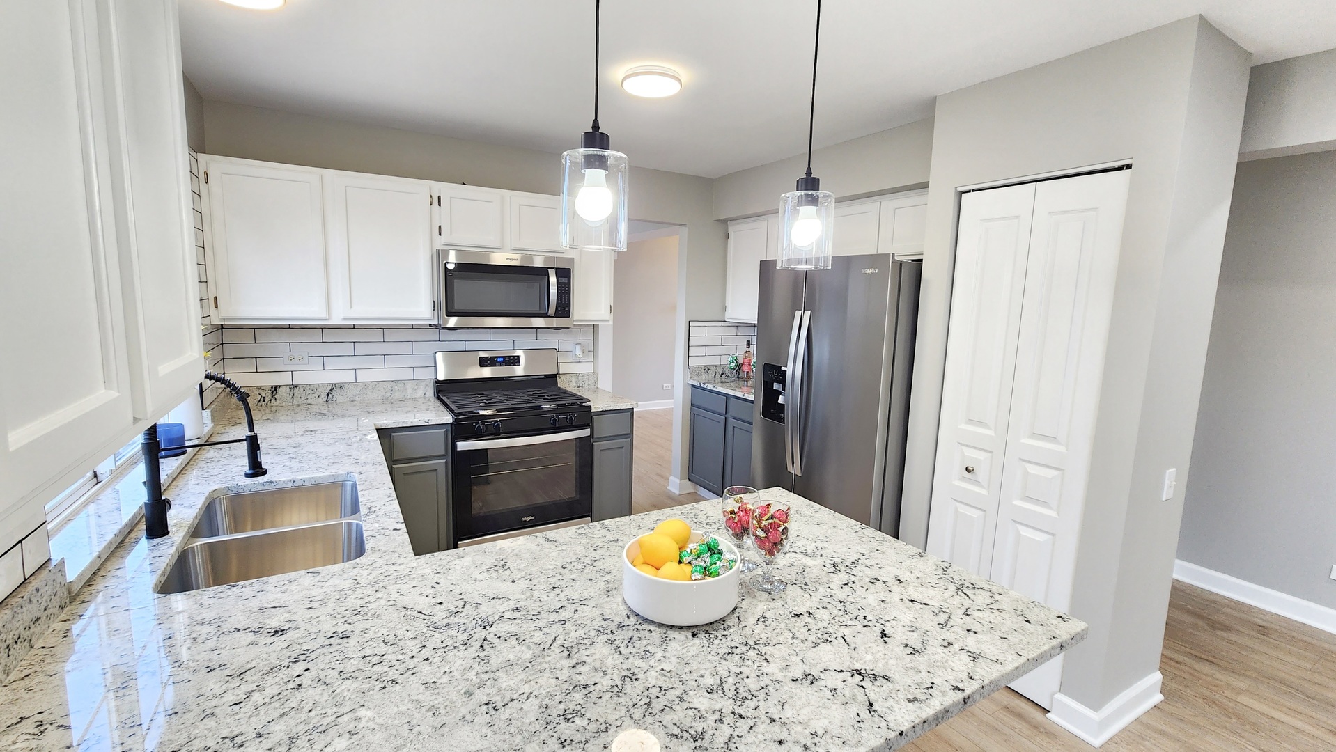 1296 Spaulding Road Bartlett, IL 60103 - Photo 10 of 37 a kitchen with stainless steel appliances granite countertop a sink refrigerator and microwave