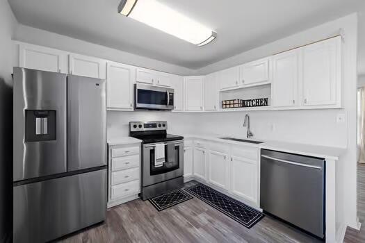 30 Lowery Road Freeport, FL 32439 - Photo 11 of 40 a kitchen with cabinets stainless steel appliances and a counter space