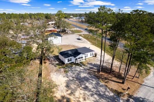 30 Lowery Road Freeport, FL 32439 - Photo 31 of 40 a view of a house with a yard and sitting area