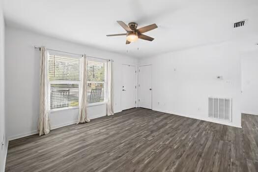 30 Lowery Road Freeport, FL 32439 - Photo 6 of 40 a view of an empty room with wooden floor and a window