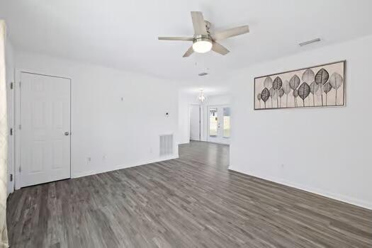 30 Lowery Road Freeport, FL 32439 - Photo 8 of 40 an empty room with wooden floor and ceiling fan