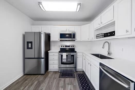 30 Lowery Road Freeport, FL 32439 - Photo 10 of 40 a kitchen with a refrigerator a sink and a stove