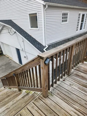 a view of wooden balcony and stairs