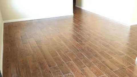 a view of wooden floor in a hallway