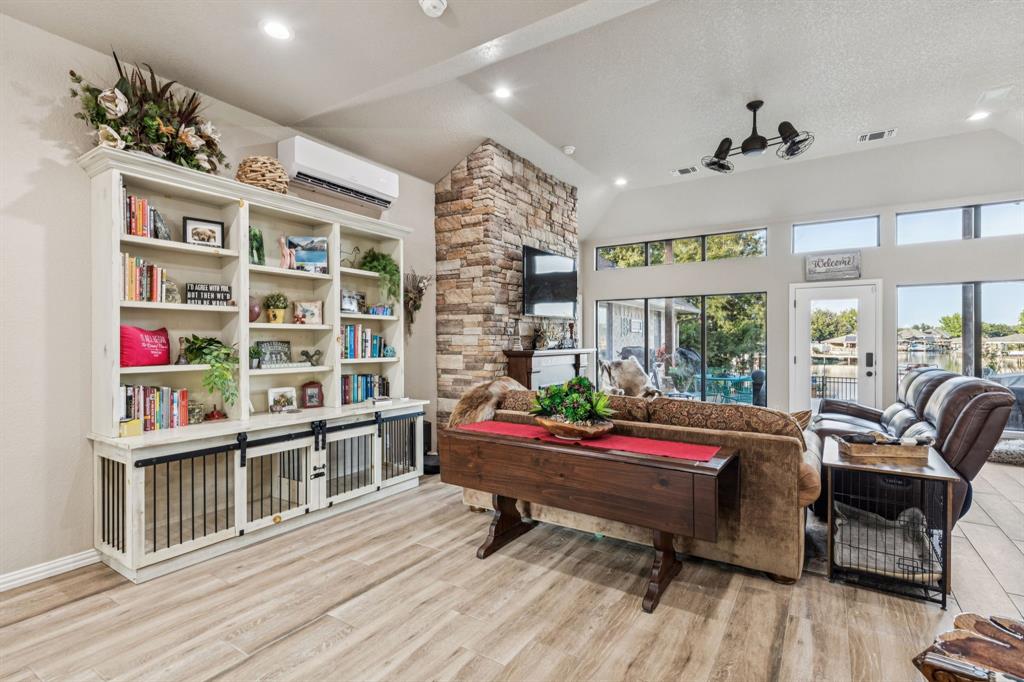 2325 River Road Granbury, TX 76048 - Photo 15 of 40 a reading room with furniture wooden floor and a book shelf