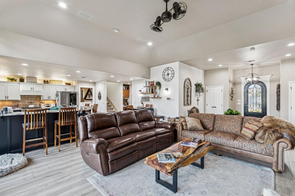 2325 River Road Granbury, TX 76048 - Photo 16 of 40 a living room with furniture and kitchen view