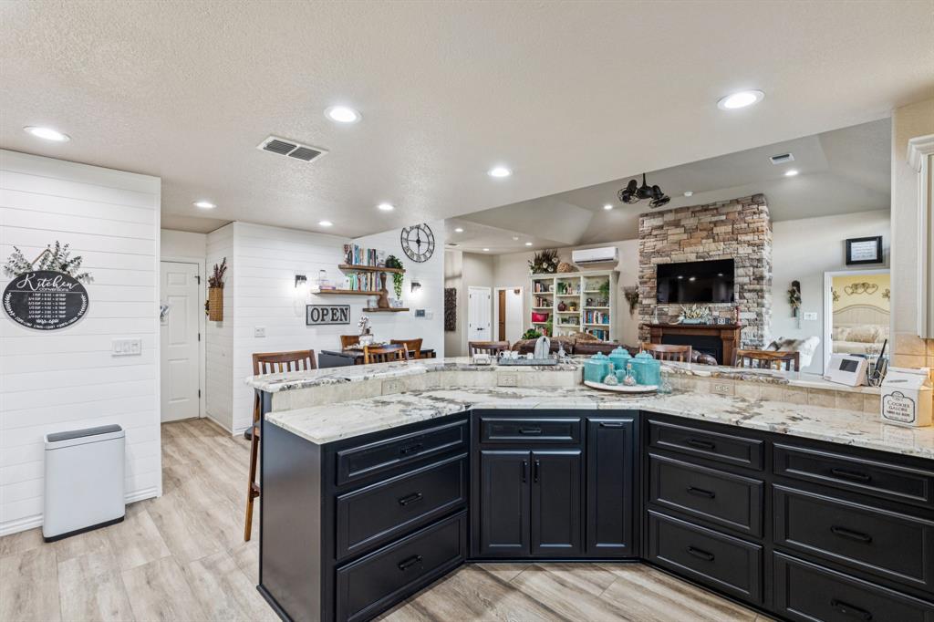 2325 River Road Granbury, TX 76048 - Photo 20 of 40 a kitchen with a sink appliances and cabinets