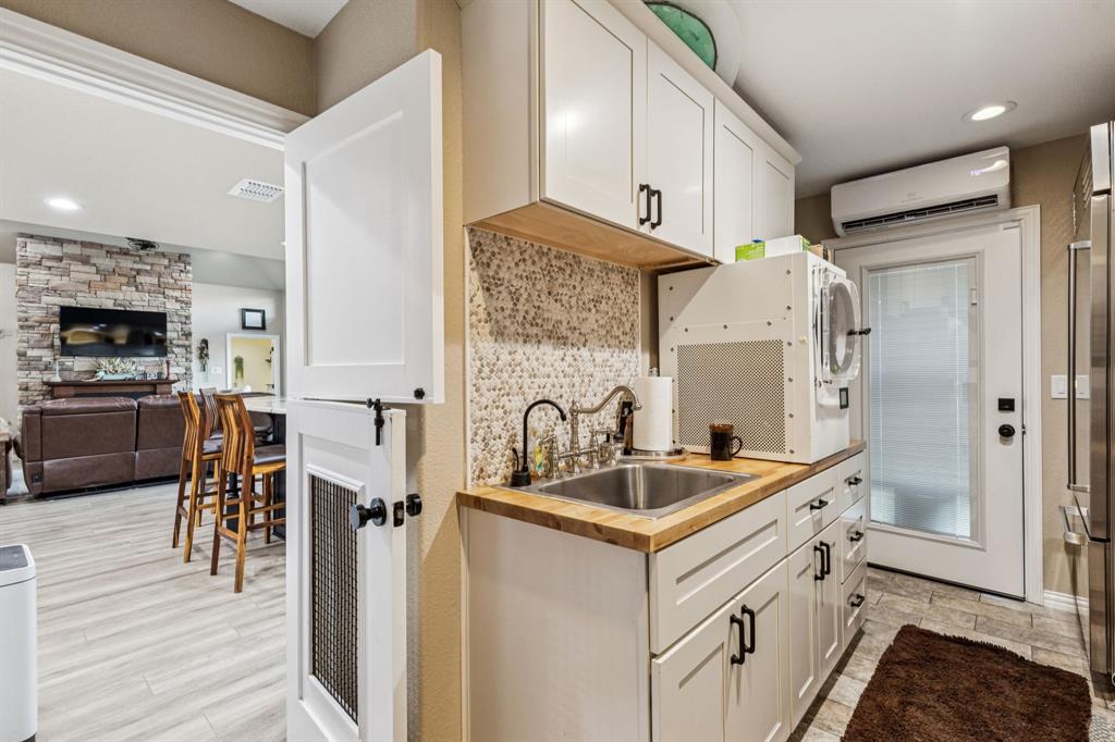 2325 River Road Granbury, TX 76048 - Photo 25 of 40 a kitchen with a sink appliances and cabinets