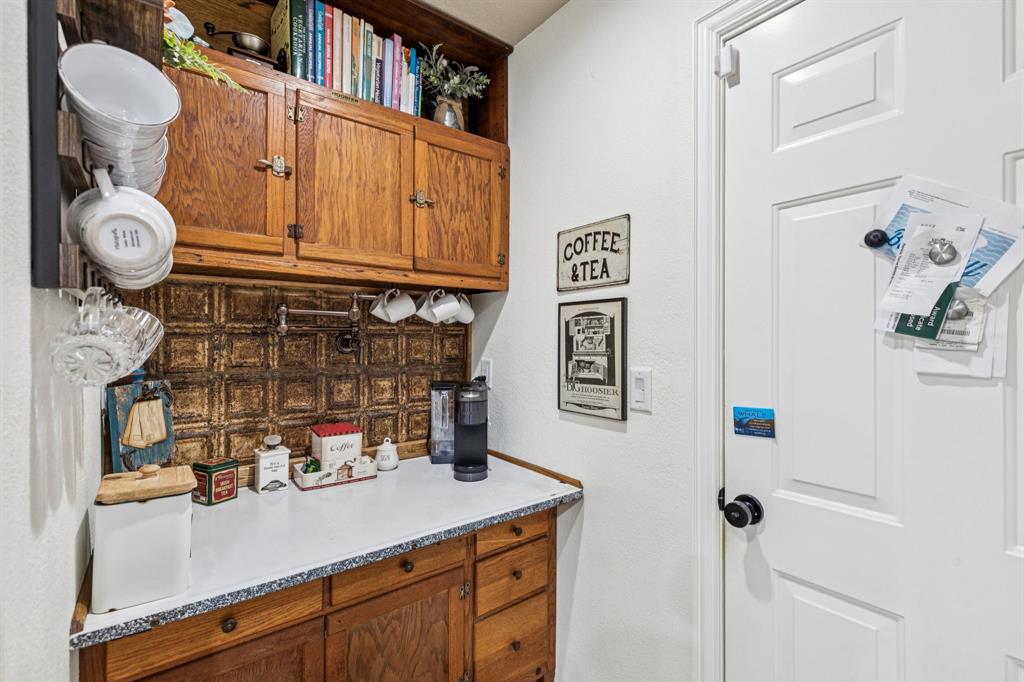 2325 River Road Granbury, TX 76048 - Photo 26 of 40 a bathroom with a sink and a mirror