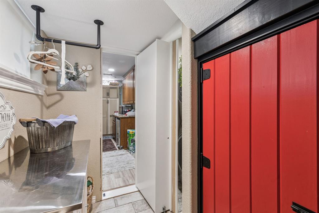 2325 River Road Granbury, TX 76048 - Photo 28 of 40 a view of a hallway with furniture and front door