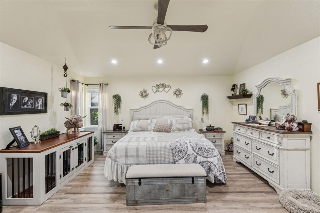 2325 River Road Granbury, TX 76048 - Photo 30 of 40 a bedroom with furniture and wooden floor