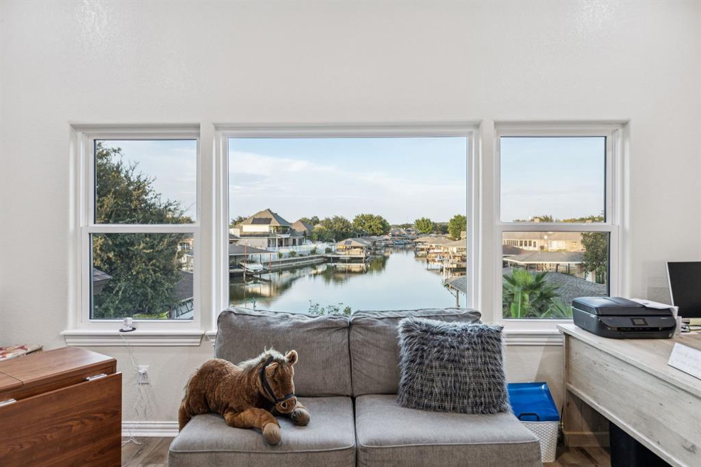 2325 River Road Granbury, TX 76048 - Photo 33 of 40 a living room with furniture and a floor to ceiling window