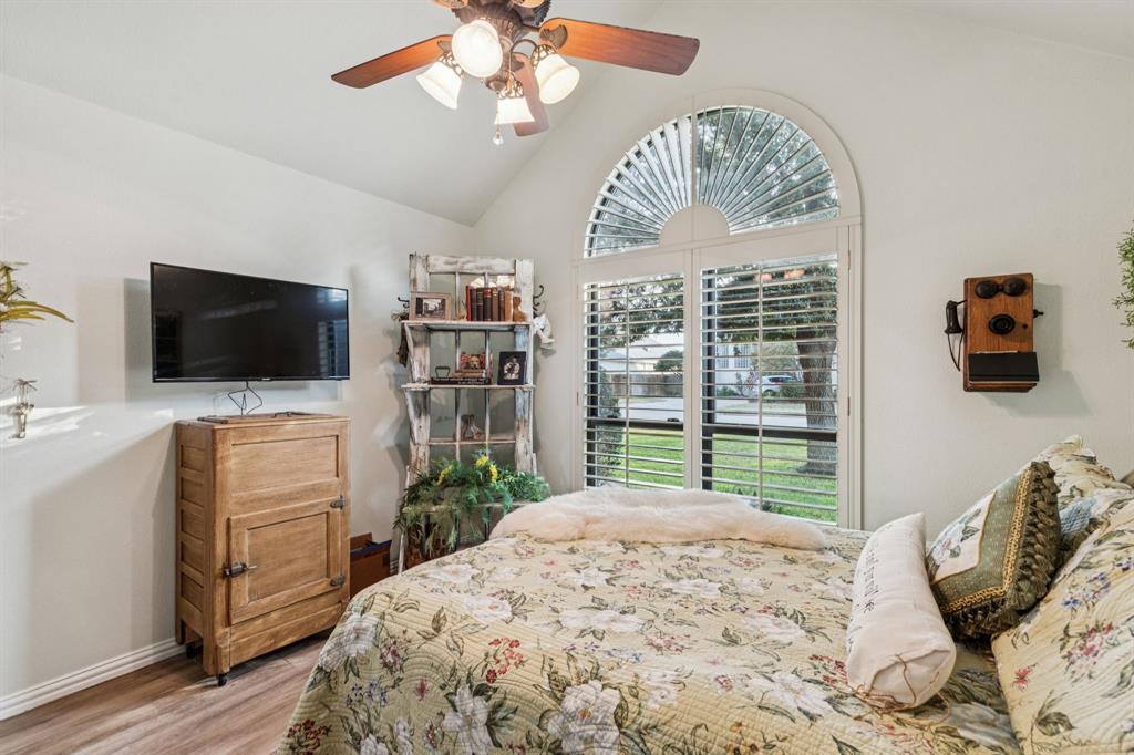 2325 River Road Granbury, TX 76048 - Photo 38 of 40 a bedroom with furniture and a flat screen tv