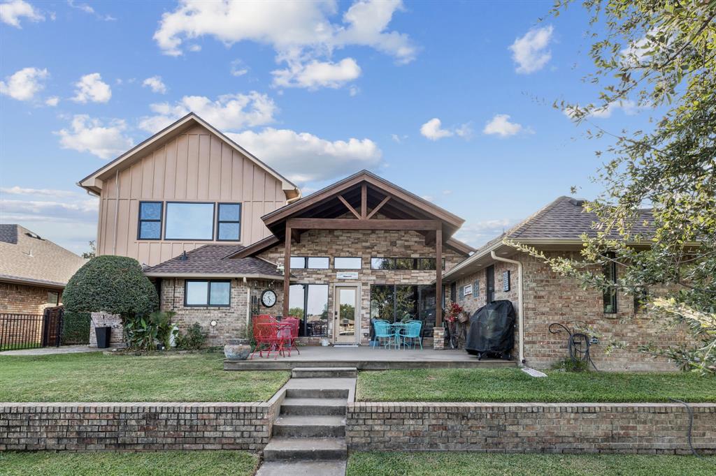 2325 River Road Granbury, TX 76048 - Photo 5 of 40 a front view of a house with a yard