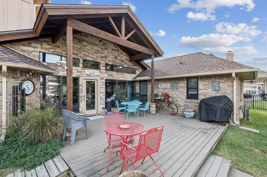 2325 River Road Granbury, TX 76048 - Photo 6 of 40 a view of a house with backyard sitting area and garden
