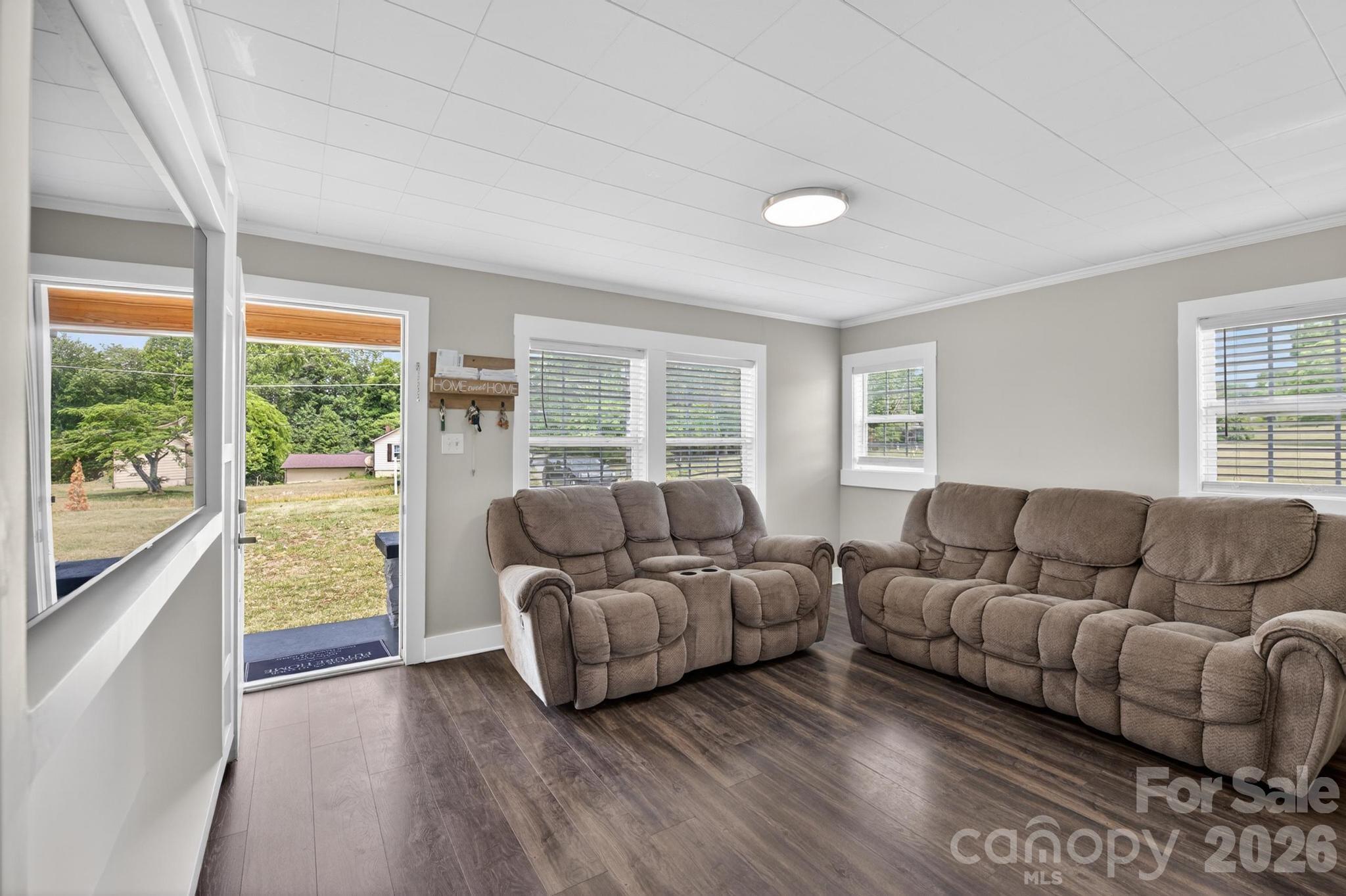 2076 Connelly Springs Road Lenoir, NC 28645 - Photo 5 of 47 a living room with furniture and a large window
