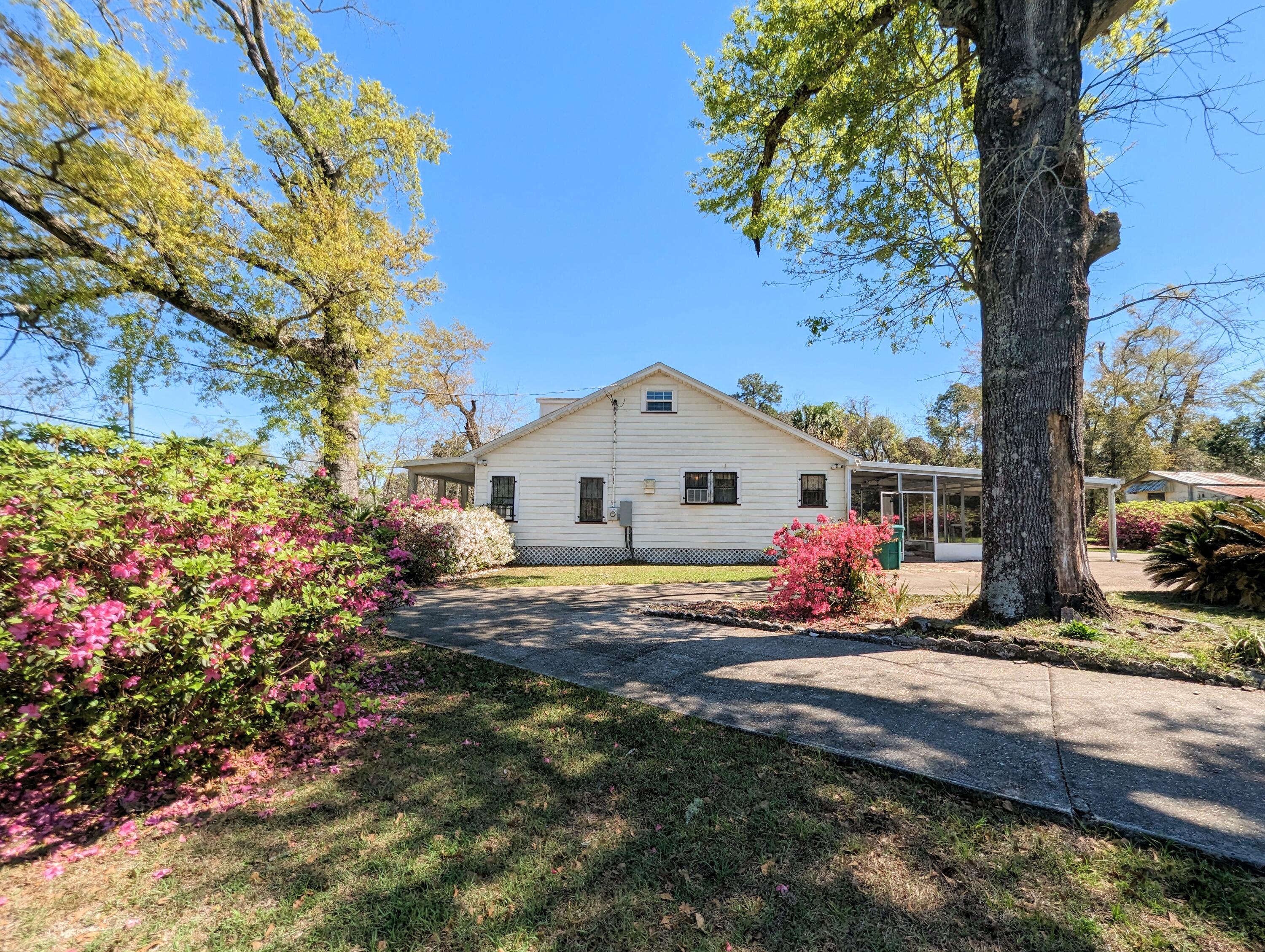 1335 Old Bonifay Road Chipley, FL 32428 - Photo 12 of 31 a view of a house with a yard