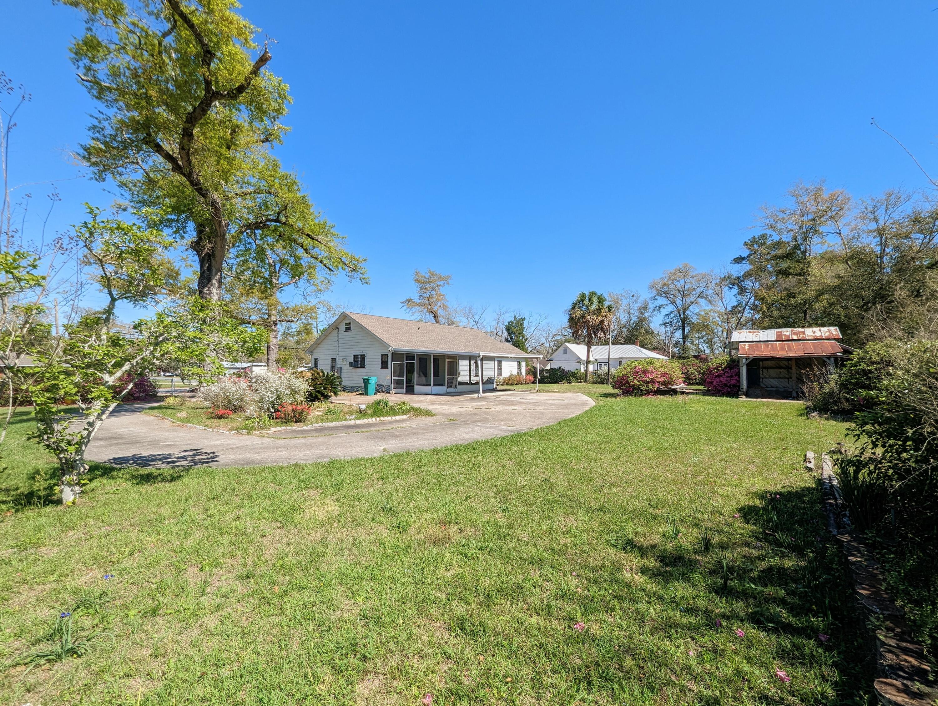 1335 Old Bonifay Road Chipley, FL 32428 - Photo 13 of 31 a view of house with outdoor space and seating area