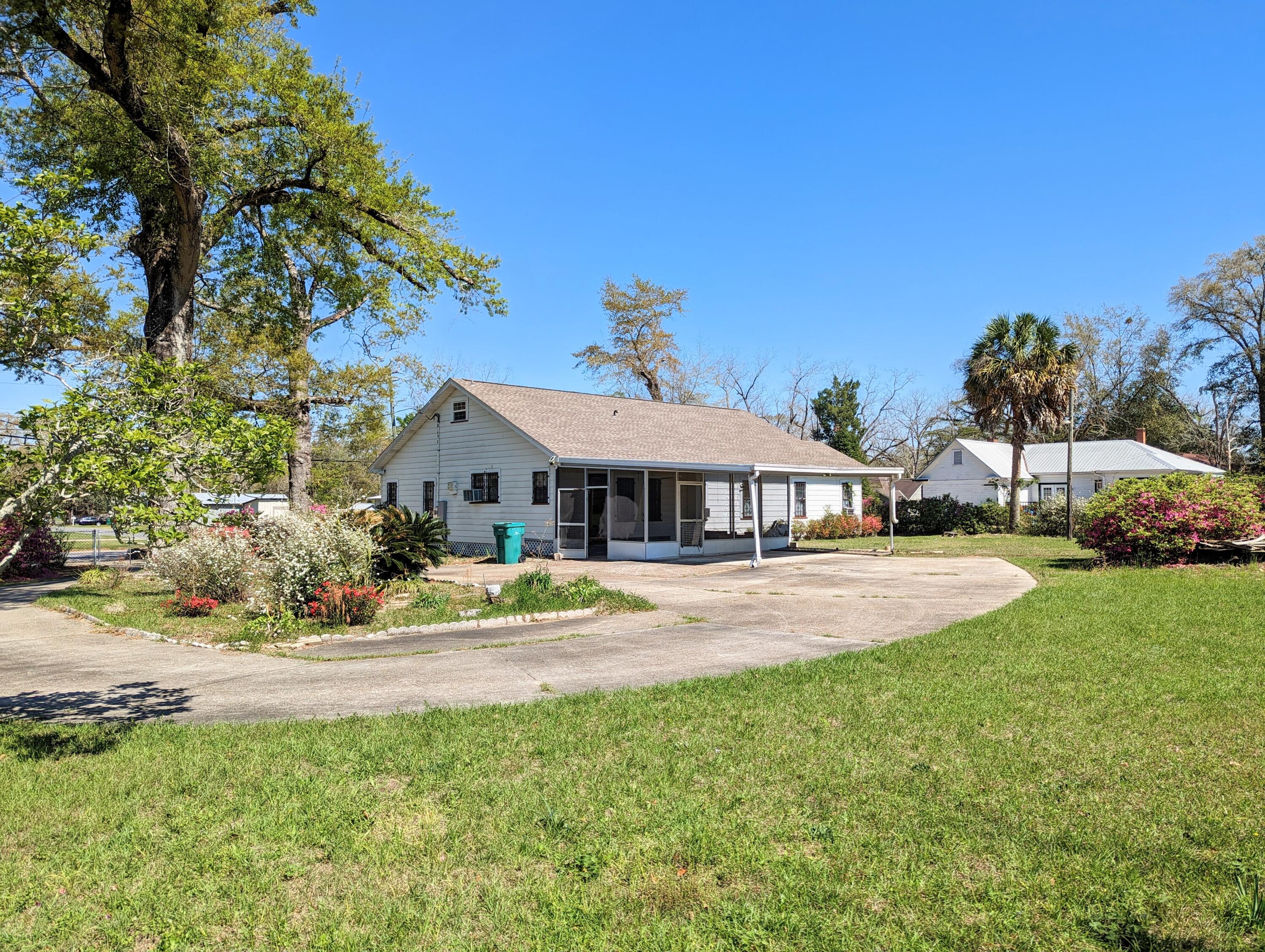 1335 Old Bonifay Road Chipley, FL 32428 - Photo 14 of 31 a aerial view of a house with swimming pool and deck