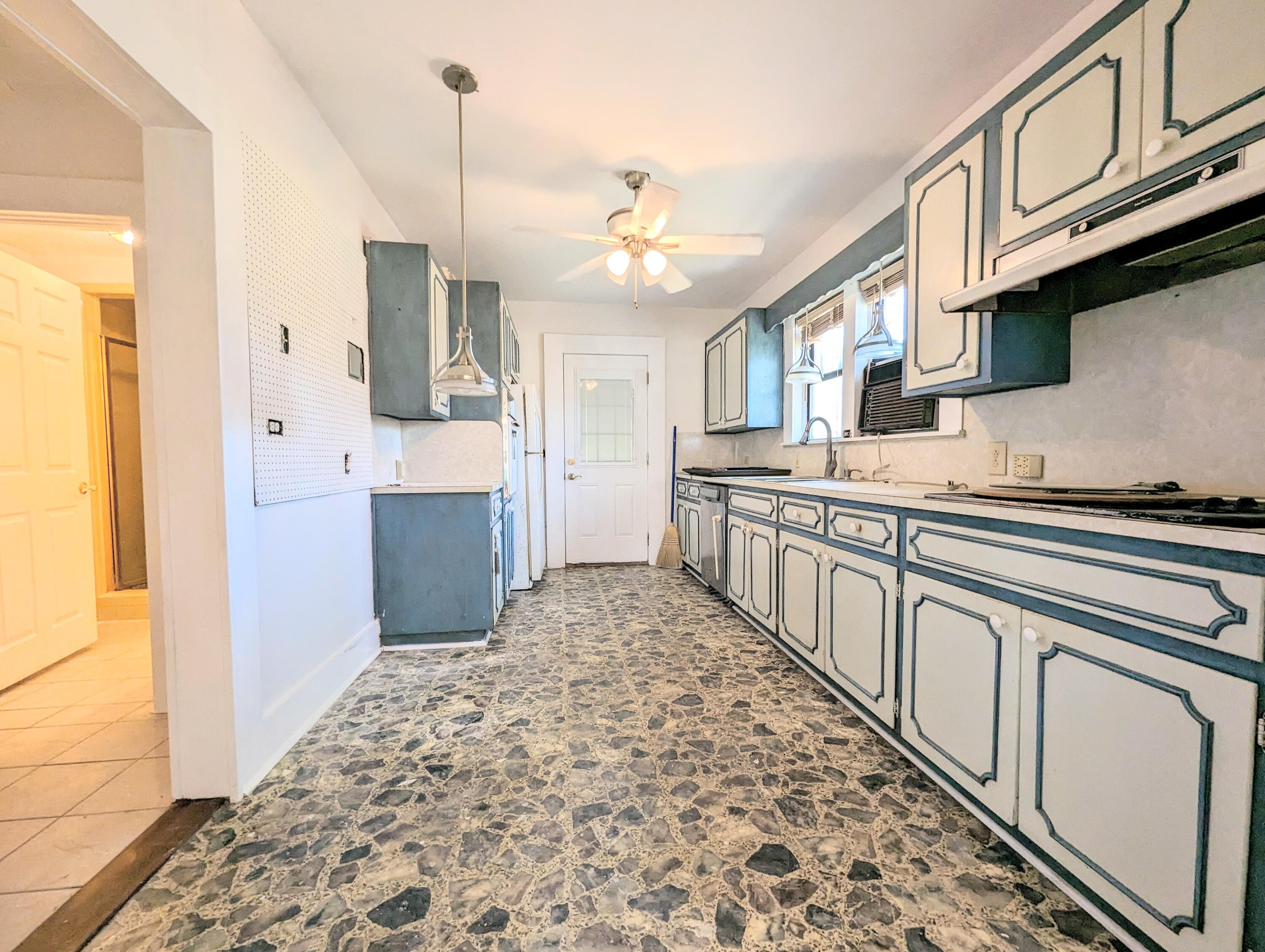 1335 Old Bonifay Road Chipley, FL 32428 - Photo 19 of 31 a kitchen with stainless steel appliances granite countertop a sink and cabinets