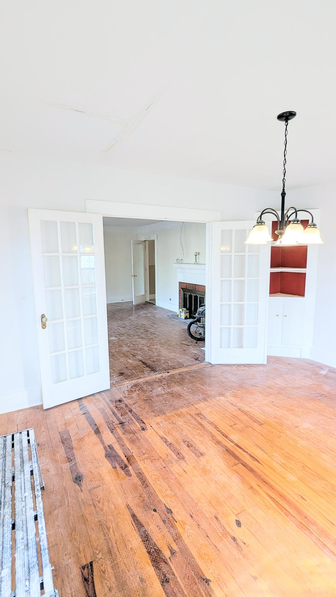 1335 Old Bonifay Road Chipley, FL 32428 - Photo 22 of 31 a bedroom with a bed and a chandelier