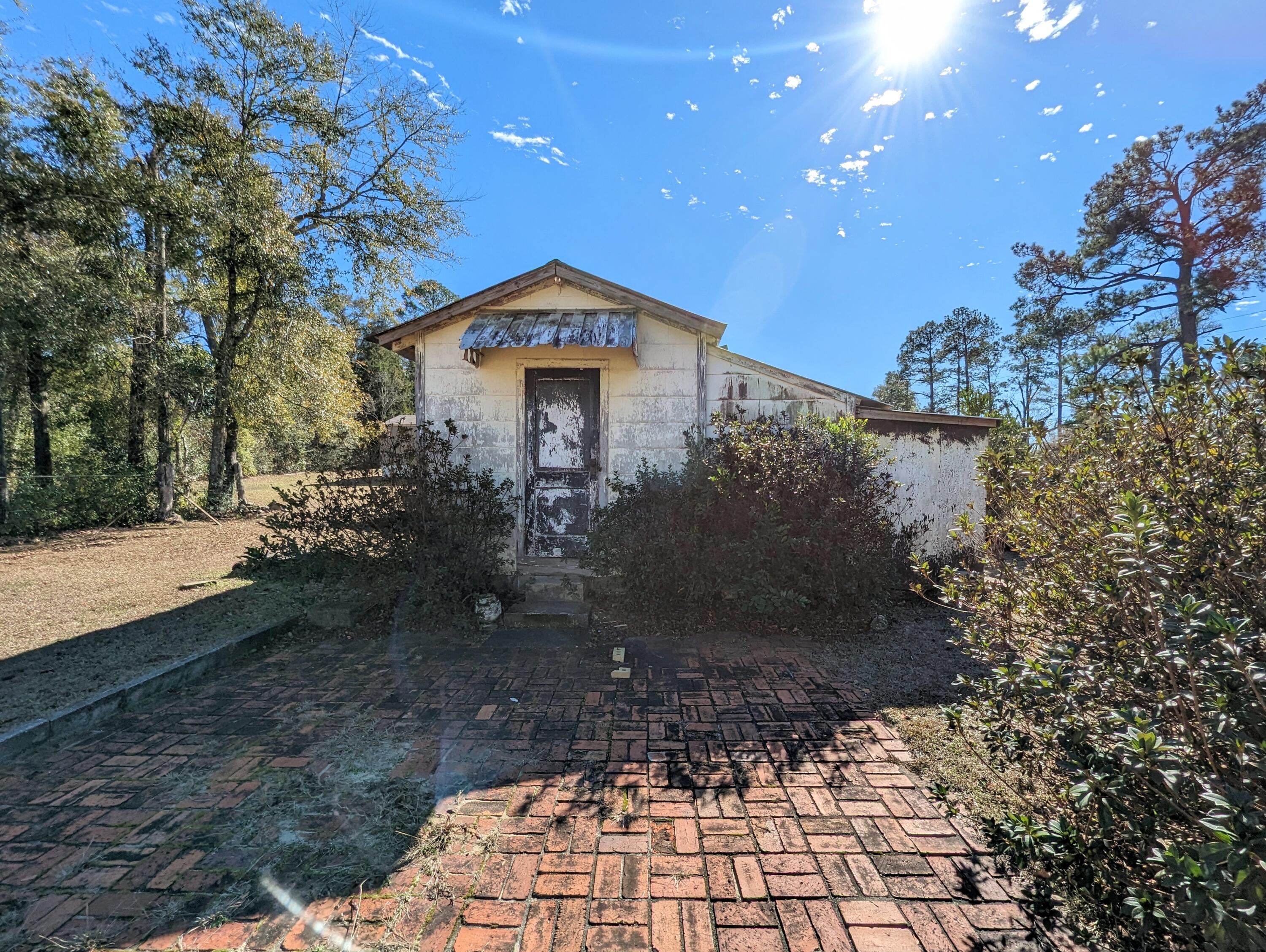 1335 Old Bonifay Road Chipley, FL 32428 - Photo 30 of 31 a front view of a house with a yard