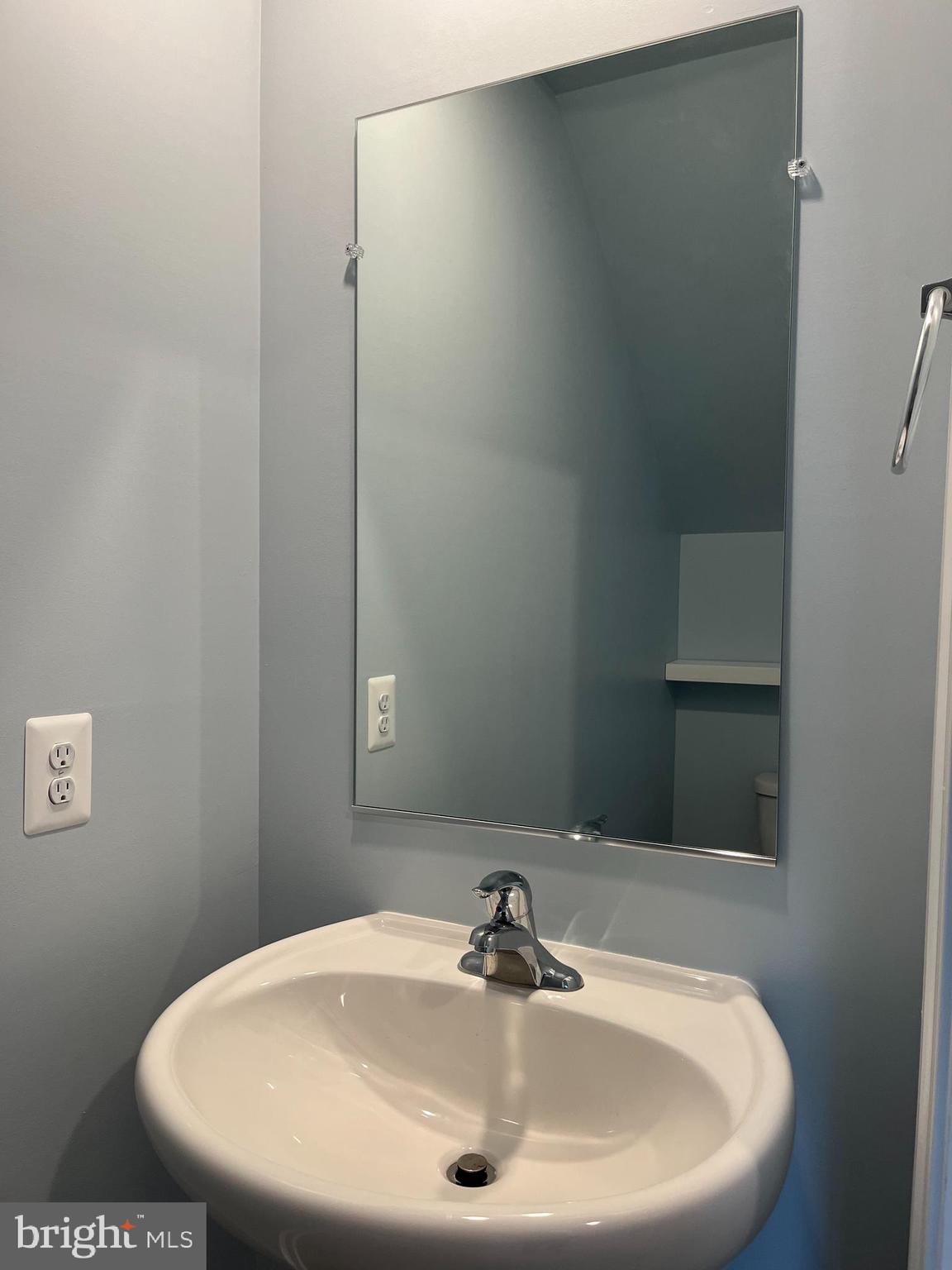 104 Rappahannock Run Falling Waters, WV 25419 - Photo 11 of 54 a bathroom with a sink and mirror