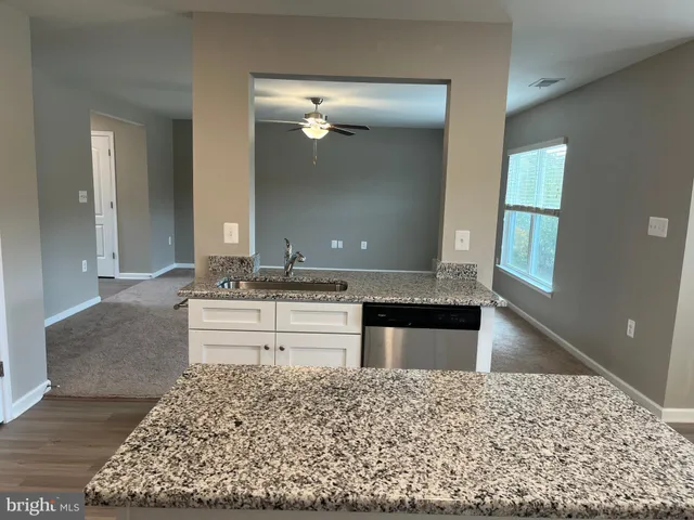 a bathroom with a bathtub sink and mirror