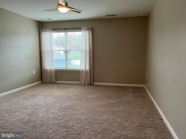 a white bath tub sitting in a bathroom