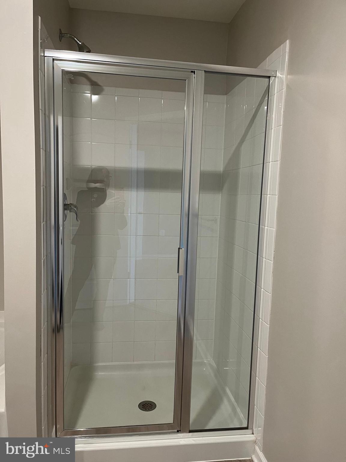 104 Rappahannock Run Falling Waters, WV 25419 - Photo 26 of 54 a bathroom with a glass shower door