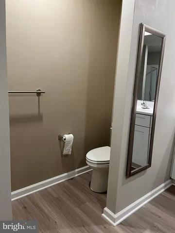 a spacious bathroom with a double vanity sink and a mirror