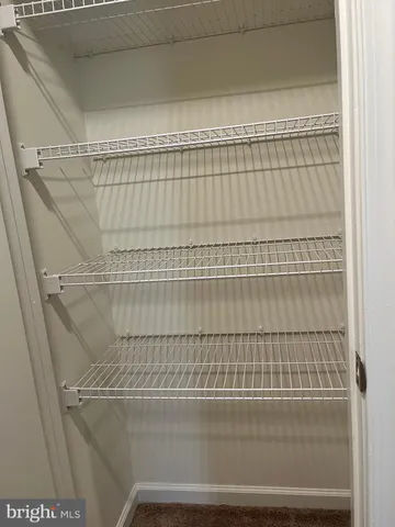 an empty room with closet area