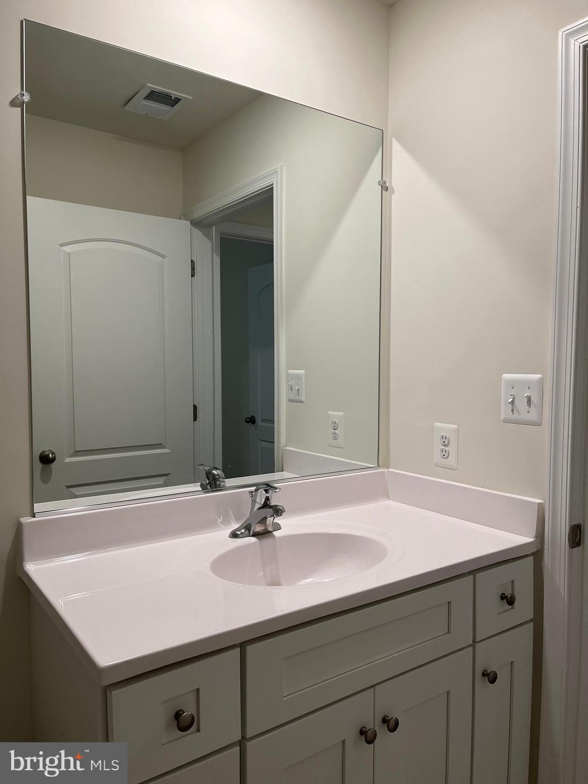 104 Rappahannock Run Falling Waters, WV 25419 - Photo 42 of 54 a bathroom with a sink and a mirror