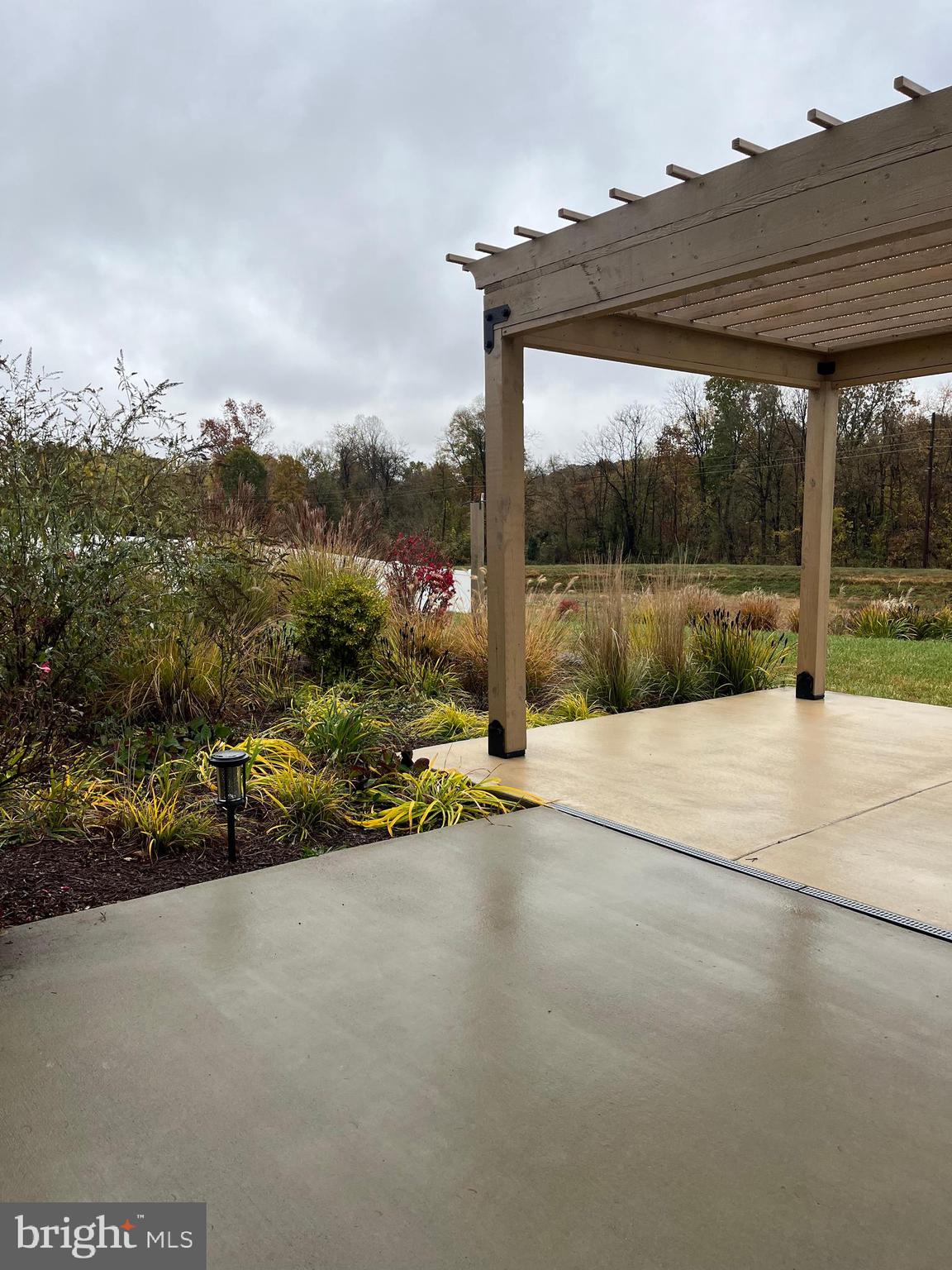 104 Rappahannock Run Falling Waters, WV 25419 - Photo 49 of 54 a view of a road with a yard