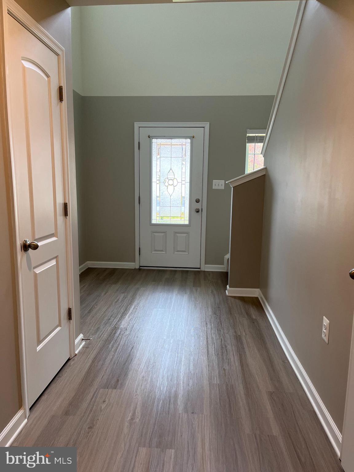 104 Rappahannock Run Falling Waters, WV 25419 - Photo 6 of 54 an empty room with wooden floor and a window