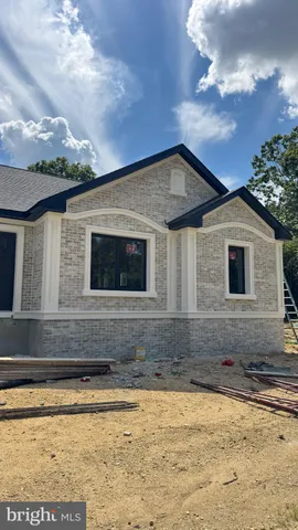 a house with trees in the background