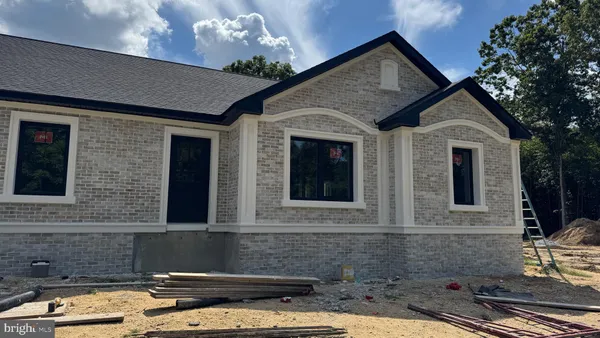 a front view of a house with parking
