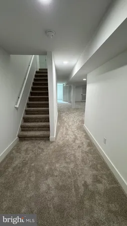 a view of a hallway with stairs