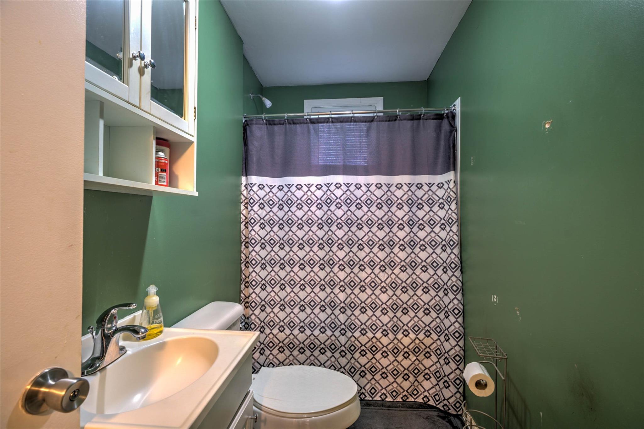 54 Bunker Street Rockingham, NC 28379 - Photo 16 of 22 a bathroom with a toilet and a sink